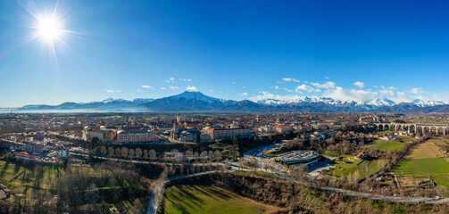 panorama drone view of Cuneo in the Itlaian Piedmont with snow-capped mountains behind