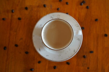 cup of coffee on wooden table