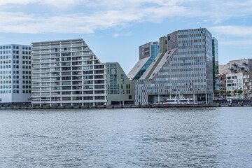 Obraz premium Panoramic view from the IJ river to Western harbor area (Amsterdam-Noord borough), along the IJ river. AMSTERDAM, The NETHERLANDS.