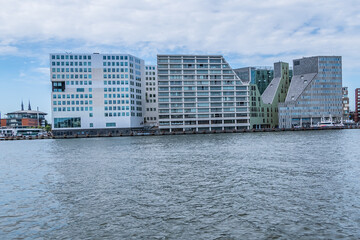 Panoramic view from the IJ river to Western harbor area (Amsterdam-Noord borough), along the IJ river. AMSTERDAM, The NETHERLANDS.