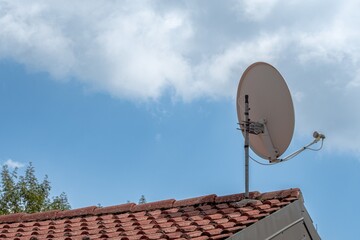 Satellite dish on the roof - 583988660