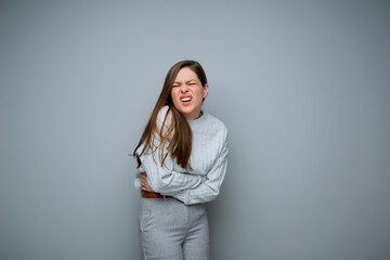 Woman with stomach pain. isolated portrait.