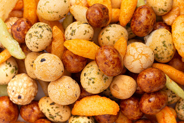 An Up Close Background of Trail Mix of Various Rice Crackers a Spicy and Salty Snack