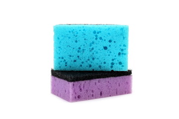 Two sponges lie on a white background.	