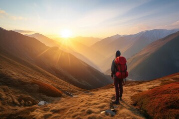 Backpacker Standing in the Mountains - Sunrise