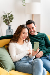 Happy couple taking selfie on smartphone