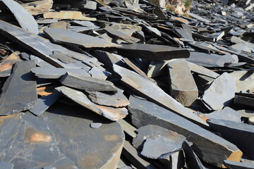 Close up of broken grey slate in quarry in Wales