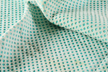 Fototapeta premium blue rubber napkin with dots can be used as a background