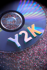 Y2K Letters on Music CD with Glittery Background - obrazy, fototapety, plakaty