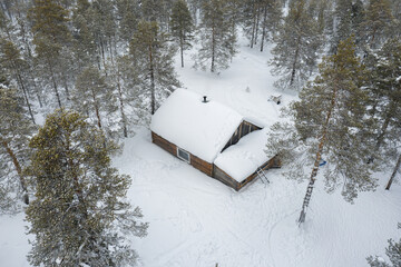 Western Siberia, the camp of reindeer herders of the Khanty people: the hut in the forest. Aerial view.
