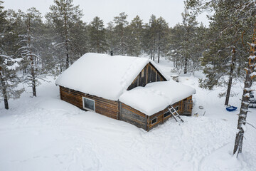 Western Siberia, the camp of reindeer herders of the Khanty people: the hut in the forest. Aerial...