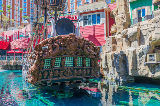 Beautiful view of colorful decorated pond with pirate ship near hotel Treasure Island.  Strip, Las Vegas. USA.