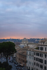 Fototapeta na wymiar Rome, view of the rooftops of the sunset city.