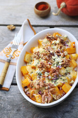 Baked pumpkin with blue cheese and walnuts, gratin