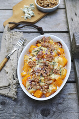 Baked pumpkin with blue cheese and walnuts, gratin