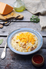 Plate of Mimolette cheese risottowith walnut, smoked paprika dressing