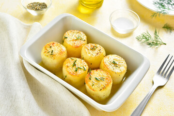 Oven baked potatoes in baking dish