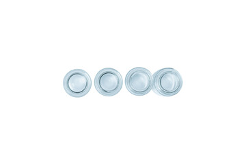 Empty small blue glass jars on a light background. View from above. isolated. PNG.