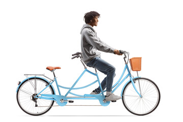 Full length profile shot of a young african american man riding a tandem bicycle