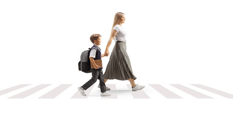 Mother taking son to school and crossing street at a pedestrian zebra sign