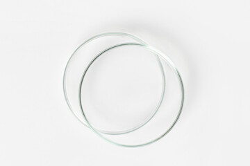 Two empty Petri dishes on a light background.