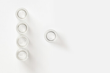 set of transparent empty jars on a light background.