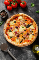 Tuna Pizza, Freshly Baked Pizza with Tuna, Mozzarella, Onion, Basil and Olives on Dark Background