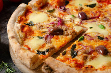 Tuna Pizza, Freshly Baked Pizza with Tuna, Mozzarella, Onion, Basil and Olives on Dark Background