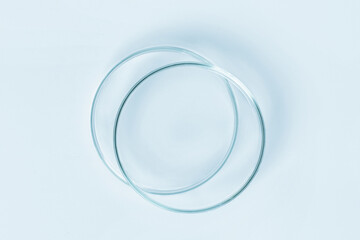 Set of Petri dishes made of blue glass. On a blue background.