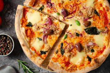 Tuna Pizza, Freshly Baked Pizza with Tuna, Mozzarella, Onion, Basil and Olives on Dark Background