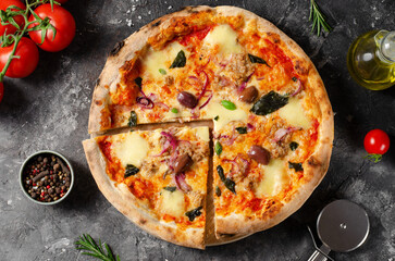 Tuna Pizza, Freshly Baked Pizza with Tuna, Mozzarella, Onion, Basil and Olives on Dark Background