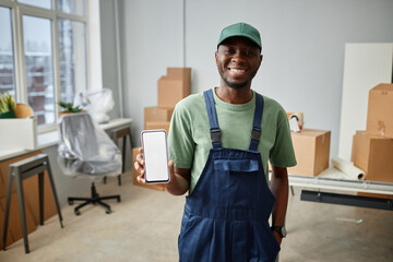 Portrait of African American worker in uniform showing the phone number on his smartphone and...