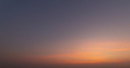 Sunset sky. Abstract nature background. Dramatic blue with orange colorful clouds in twilight time.