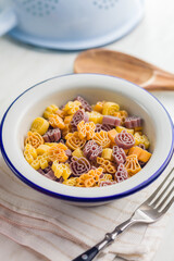 Pasta of various scary shapes. Uncooked halloween pasta in bowl.