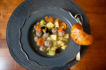 Meat ball and potato homemade soup with pastry