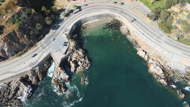 Plaza Rub&eacute;n Dar&iacute;o in front of the beach and viewpoint in Paseo Altamirano, Valpara&iacute;so, sunny morning, drone flight, vertical ascending panning.
