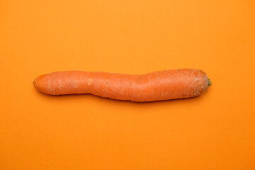 Fresh Carrot isolated on orange background