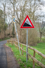 German road sign 15 percent drop at the road mountain, Germany, vertical shot