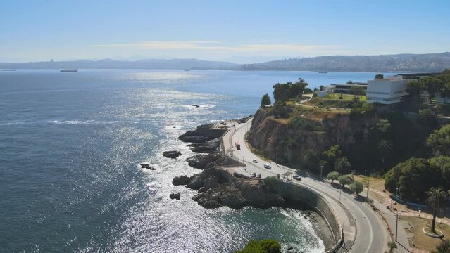 Plaza Rub&eacute;n Dar&iacute;o in front of the beach and viewpoint on Paseo Altamirano, panning to the left over the Pacific and Vi&ntilde;amarino coastline in the morning mist. Sunny morning, drone flight, shine on the 