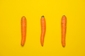 Fresh Carrots isolated on yellow background
