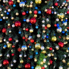 Christmas decorations on a large tree close up background