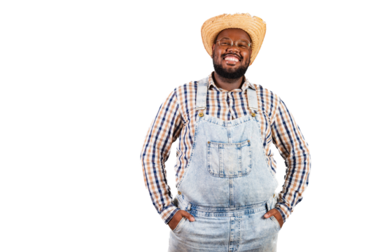 brazilian black man wearing country clothes from festa junina, festa de são joão. Wearing a straw hat..Smiling hands in pocket.