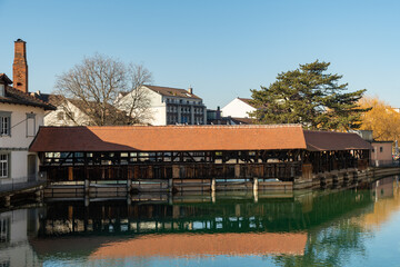 Wooden bridge over the Aare river in the city of Thun in Switzerland