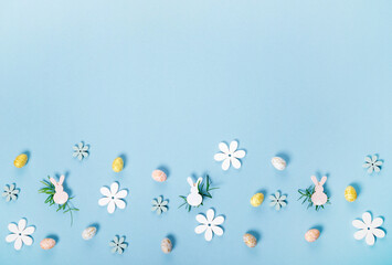 Festive Easter border, frame from easter eggs and spring flower crocus on blue background.