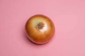 Organic whole white onion on a pink background. Cool minimal flat lay, copy space