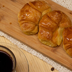 Coffee with croissants in closeup on still life
