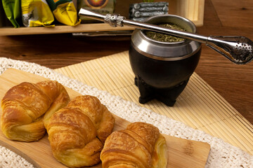 Uruguayan breakfast. Croissants and preparation of mate. Yerba mate.
