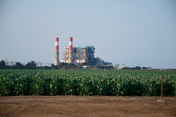 Oxnard California power plant on pacific ocean coast distant photo from farm field