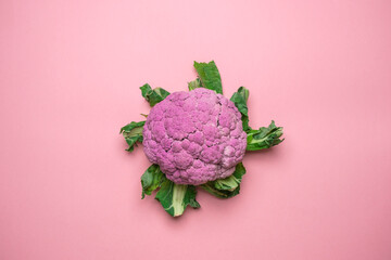 Pink cauliflower on a pink background. Cool minimal flat lay, copy space.
