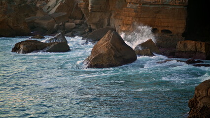 Sea waves crashing cliff in summer. Dangerous seashore nature beauty in motion.